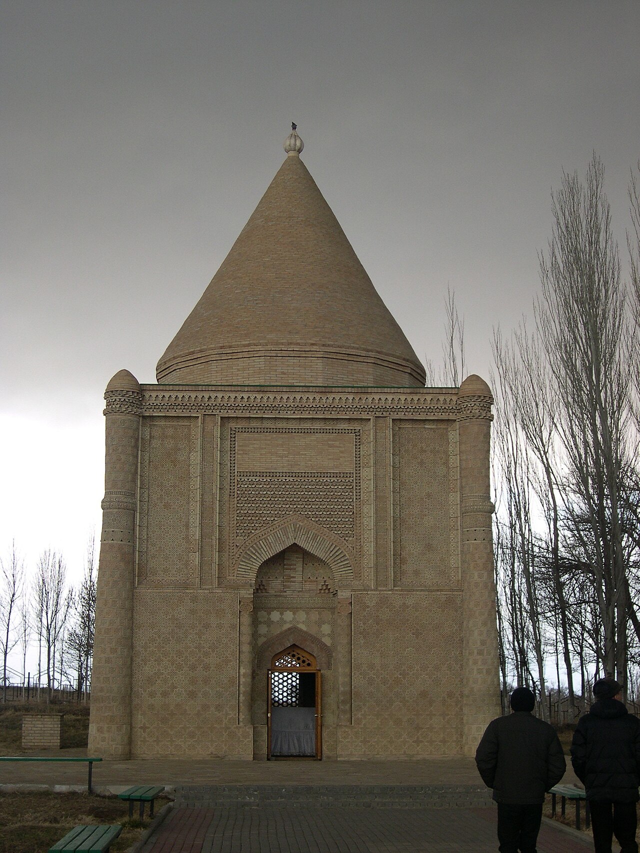 Carved terracotta panels and corner columns on the facade of the Aisha Bibi mausoleum