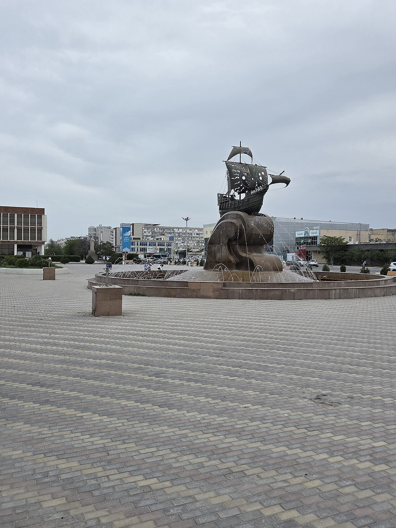 The bronze Aktau ship sculpture and its fountain in central Aktau