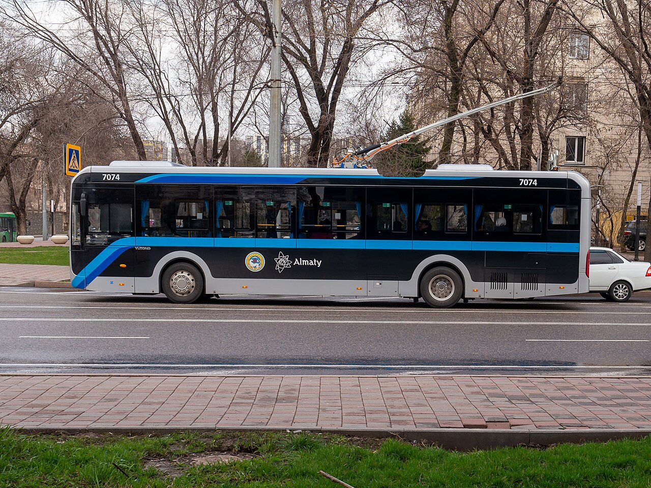 A modern trolleybus in central Almaty, where a single ride across town costs around 100–150 tenge