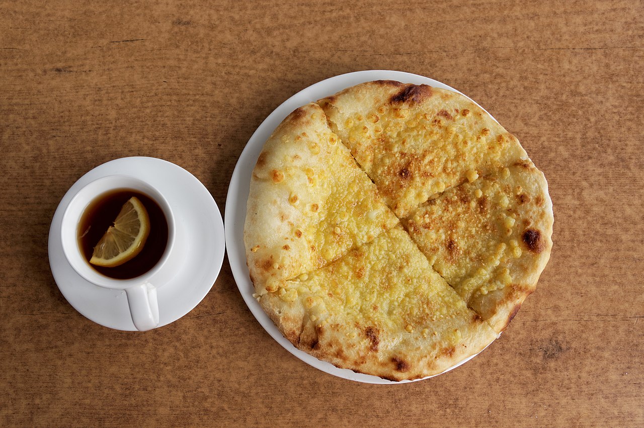 Georgian khachapuri cheese bread with tea