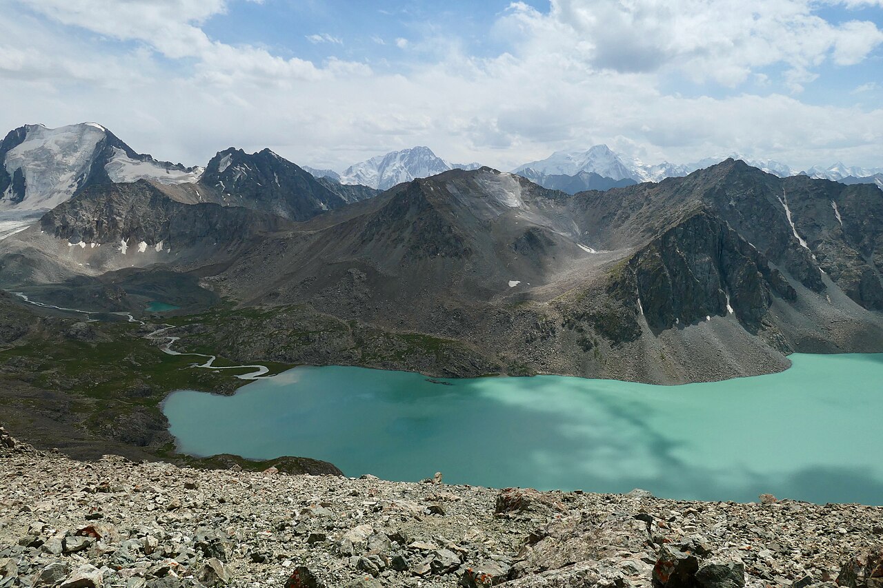 The turquoise Ala-Kol lake above Karakol in Kyrgyzstan, the trekking highlight of a Kazakhstan and Kyrgyzstan itinerary