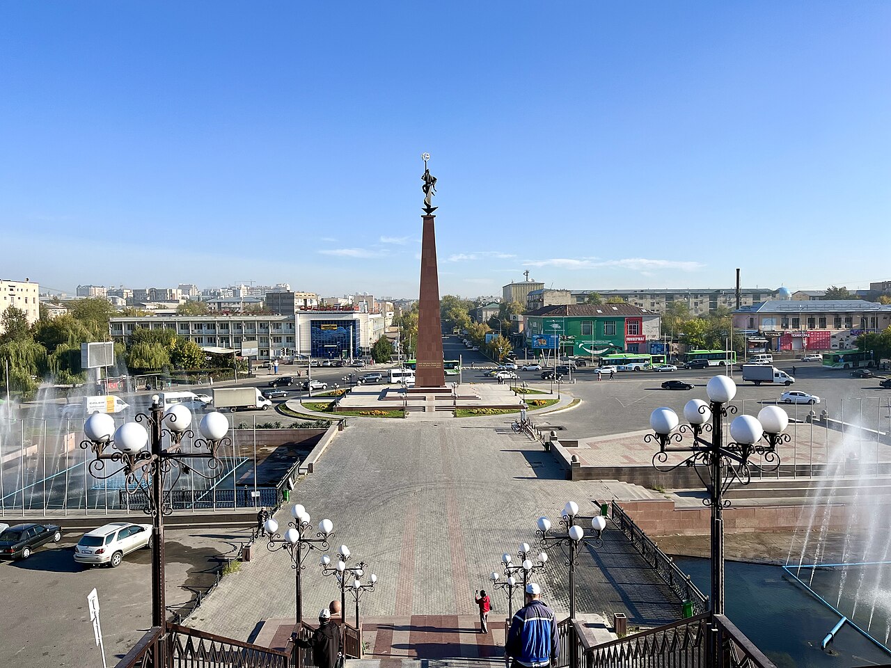 Ordabasy Square in Shymkent with the Zher-Ana monument, fountains and city buses