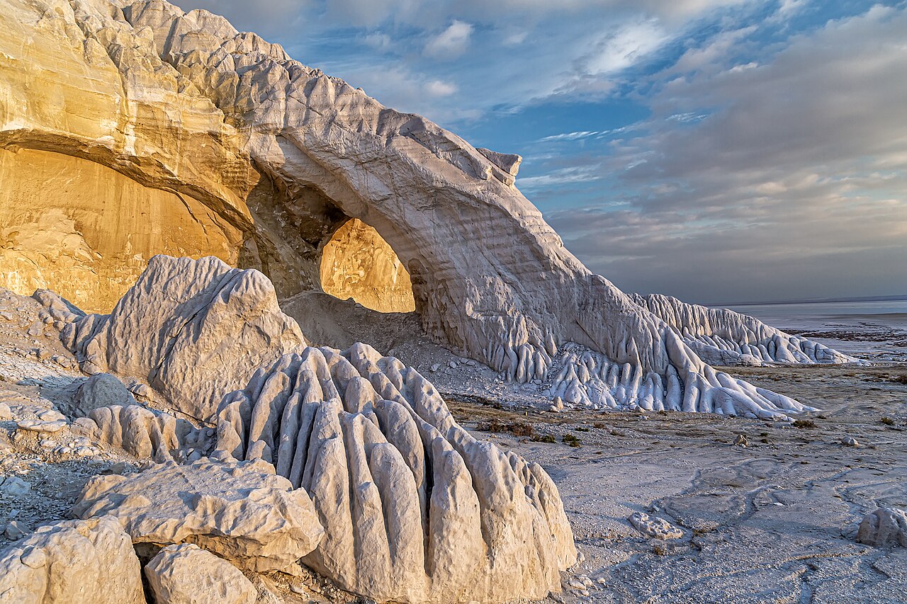 The white chalk cliffs of the Tuzbair salt flat at golden hour, Mangystau